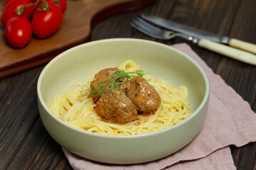 A plate of spaghetti pasta with meatballs
