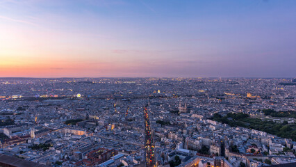 Panorama of Paris after sunset day to night timelapse. Top view from montparnasse building in Paris - France