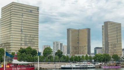 National Library of France timelapse, whose four buildings in the form of open books surround a wooded area.