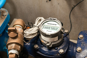 Water meter in building with commercial and residential units. Digital measuring device for water...