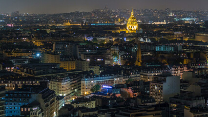 Aerial panorama above houses rooftops in a Paris night timelapse