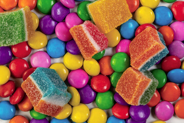 Colorful candies and jelly candies background Top view