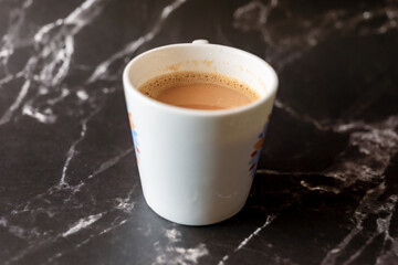 A Coffee cup on black marble background Coffee break concept