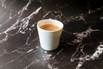 Coffee cup on black marble background Coffee break concept