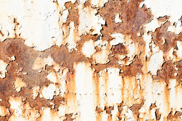 Rusty metal texture. Corrosion background. White peeling paint. Grunge rust on metal. Cracked paint pattern.