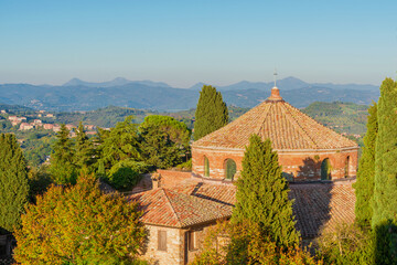 Temple of Saint Michael in Perugia, a very old church built in the 5th century, with Umbria beautiful countryside - 756677243