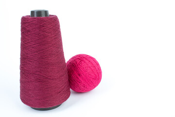 Knitting yarn for knitting on white background. red.