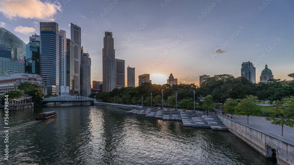 Wall mural Singapore skyscrapers skyline with white Anderson Bridge near esplanade park day to night timelapse.