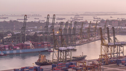 Fototapeta premium Commercial port of Singapore aerial day to night timelapse.