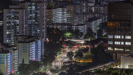 Aerial skyline with apartment buildings and skyscrapers of Singapore night timelapse