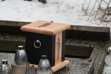 funeral urn with a cross