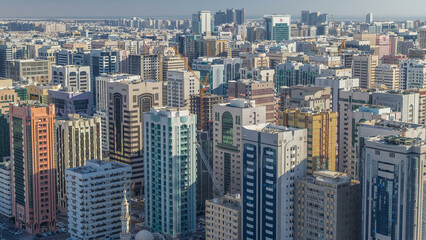 Fototapeta na wymiar Aerial skyline of Abu Dhabi city centre from above timelapse