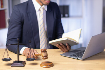 Brass scales are placed on lawyers desks in legal advice offices as a symbol of fairness and...