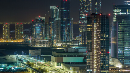 Fototapeta na wymiar Aerial skyline of Abu Dhabi city centre from above night timelapse