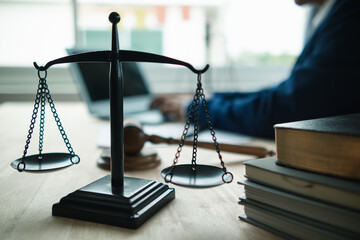 Brass scales are placed on lawyers desks in legal advice offices as a symbol of fairness and...