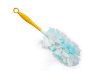 Artificial fiber duster with plastic yellow handle isolated on white background, soft focus