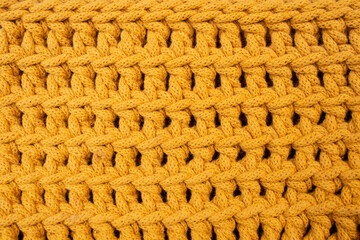 Orange cotton cord crochet pattern, abstract texture background, soft focus