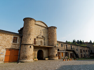 Main entrance of Sainte-Croix-en-Jarez, former priory now fortified town, Pilat, France 