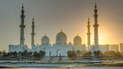 Fotobehang Sheikh Zayed Grand Mosque in Abu Dhabi at sunset timelapse, UAE © neiezhmakov