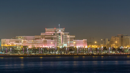 Fototapeta na wymiar Doha skyline with Ministry of Interior night timelapse. Doha, Qatar, Middle East