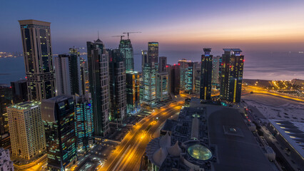 The skyline of the West Bay area from top in Doha night to day timelapse, Qatar.