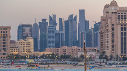 View from Katara Beach day to night timelapse in Doha, Qatar, towards the West Bay and city center