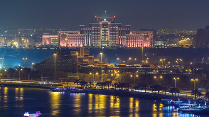 Fototapeta premium Doha skyline with Ministry of Interior and Post office night timelapse. Doha, Qatar, Middle East