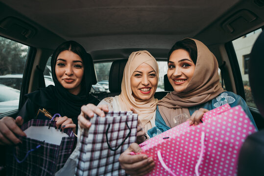 Three women friends going out in Dubai. Girls wearing the united arab emirates traditional abaya