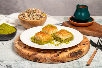 Baklava with pistachios on a wooden background. Turkish cuisine delicacies. Ramadan Dessert. local...