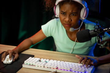 Professional gamers participate in an esports tournament, showcasing competitive skills in popular...