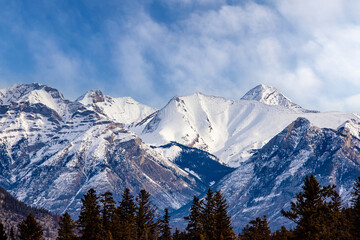 Snow-capped mountain peaks in the Canadian Rockies as seen from Banff National Park - 756707874