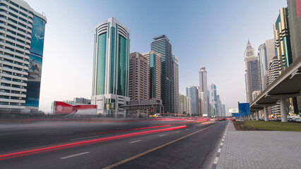 Fototapeta na wymiar Skyscrapers at the Sheikh Zayed Road day to night in Dubai timelapse hyperlapse