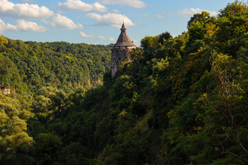 View of Canyon of Smotrych River with ancient watch tower called Pottery Tower in the top of the hill, Kamianets-Podilskyi city, Western Ukraine