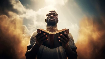 Afwasbaar fotobehang Man Reading Holy Bible with Sunlight and Clouds © ugguggu
