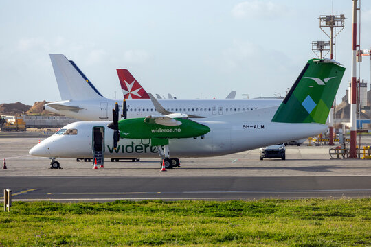 Luqa, Malta - March 5, 2024: Wideroe De Havilland Canada DHC-8-103 Dash 8 (Reg.: 9H-ALM) just after painting at ACM in Wideroe colors. To be registered LN-WIY.
