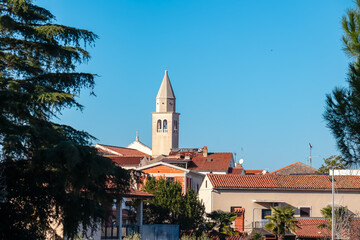 Scenic view of parish church of Saint Bernard in city centre of coastal town Funtana, Istria,...
