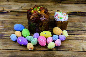Traditional easter bread and easter eggs made of styrofoam on a wooden background
