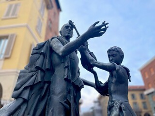 Italy, Cremona 03.2024 Monument to Stradivari in Cremona. Bronze statue of Antonio Stradivari. The...