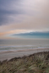 Fototapeta na wymiar Beach near Domburg town in spring fresh morning with cloudy sky