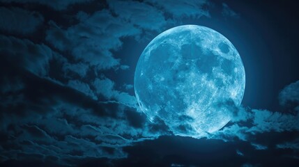 A serene image of a full moon in a cloudy night sky. Ideal for backgrounds or night-themed designs