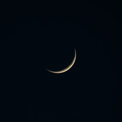 Obraz na płótnie Canvas New moon in the dark sky