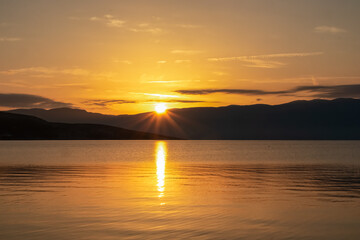Romantic sunset seen from idyllic coastal town Baska, Krk Island, Primorje-Gorski Kotar, Croatia,...