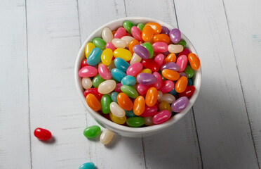 Colorful jelly beans in a bowl on the table.