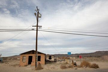 Barstow, California, USA - June 20, 2020: Afternoon sun shines on a derelict neighborhood of...