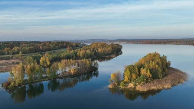 Beautiful autumn lake with sand islands like atol. Lake pogoria in Dabrowa Gornicza Poland aerial drone photo view