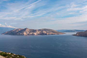 Obraz premium Aerial view of deserted island Otok Prvic in idyllic coastal town Baska, Krk Island, Primorje-Gorski Kotar, Croatia, Europe. Majestic coastline of Kvarner bay in Mediterranean Adriatic Sea in summer