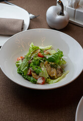 Caesar salad with a signature dressing at an exquisite restaurant.