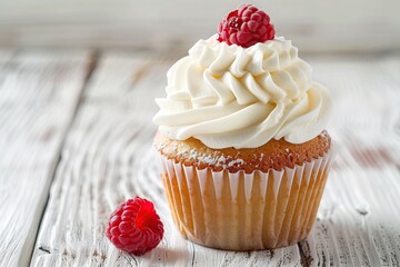 Tasty cupcake with butter cream and ripe raspberry on wooden table - obrazy, fototapety, plakaty