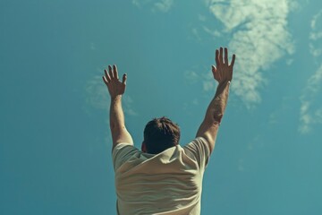 A man reaching up into the sky to catch a frisbee. Suitable for sports and leisure concepts