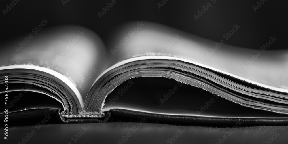 Poster An open book resting on a table. Suitable for educational concepts